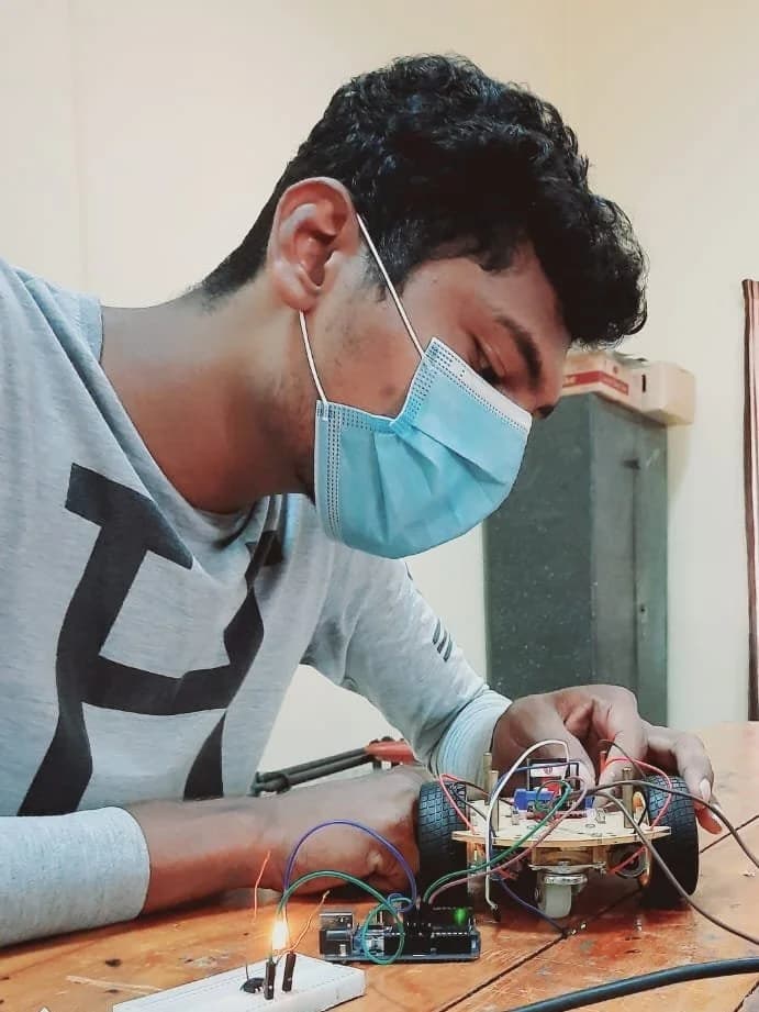 A student working with electronic components